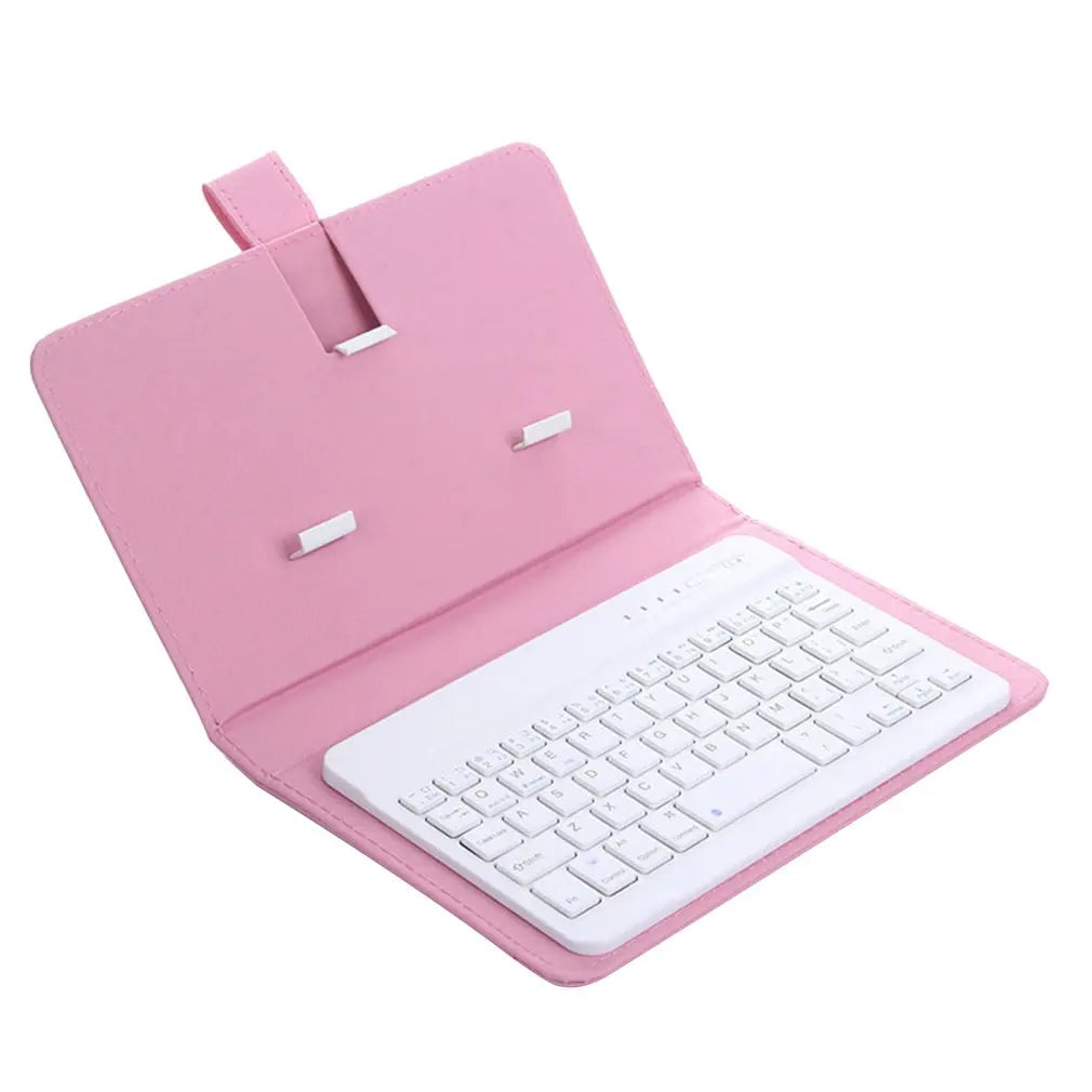 Pink keyboard cover with a white keyboard inside on a white background