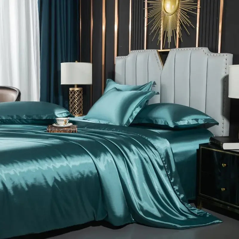 Teal satin bedding set on a bed in a stylish bedroom with decorative elements.