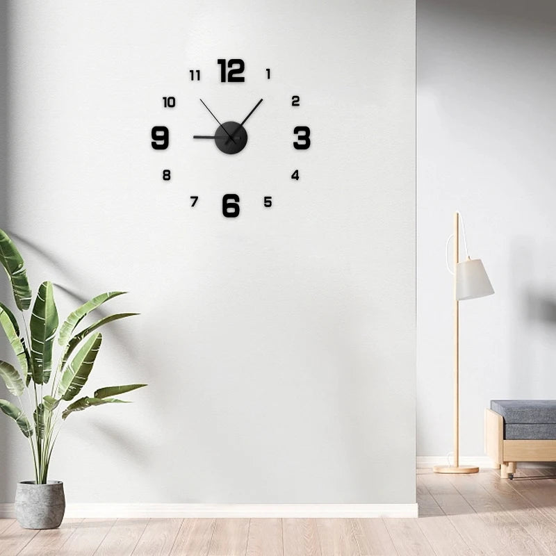 Black wall clock on a white wall with a plant and lamp in the background