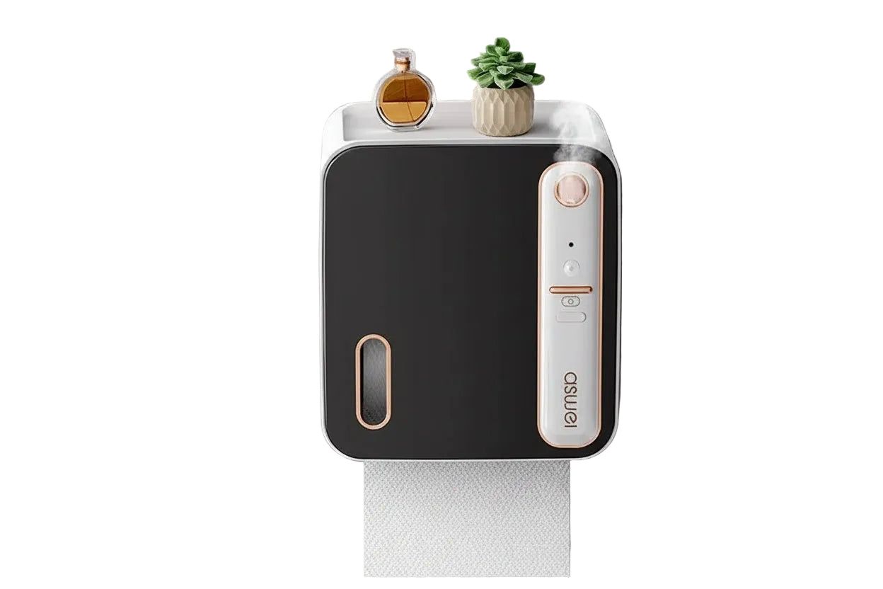 Wall-mounted paper towel holder with steam coming out, placed on a gray surface.