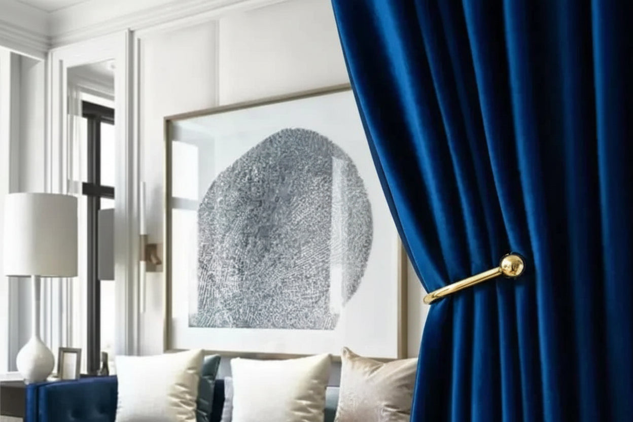 Blue curtain with gold handle in a living room setting, featuring SNQP Home Store branding.