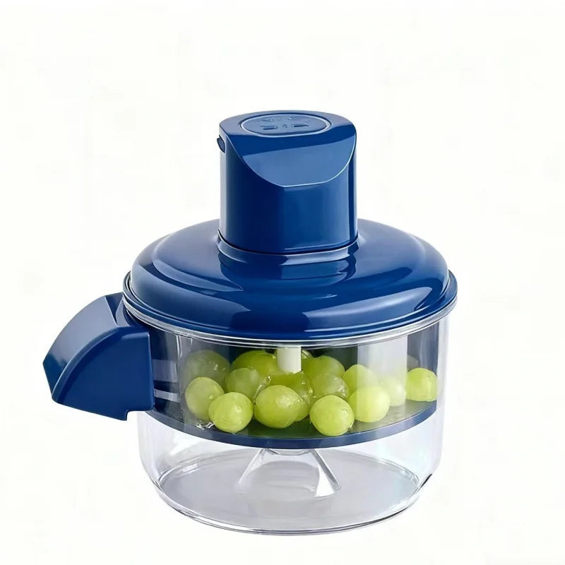 Blue hand juicer with green grapes inside on a white background