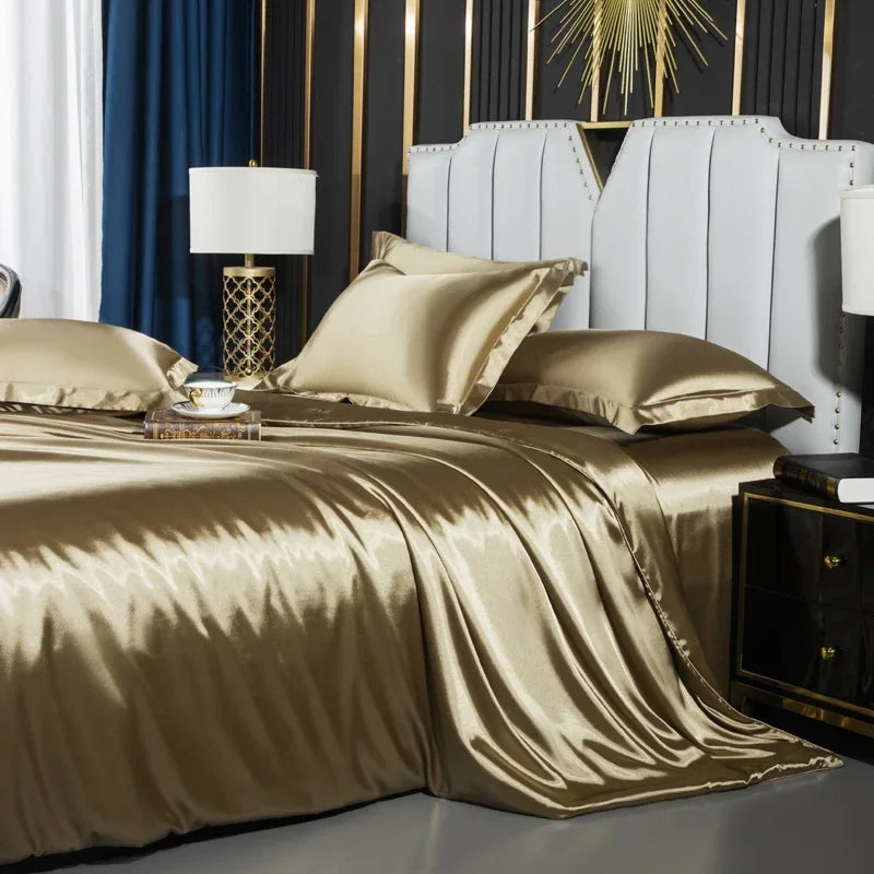 Gold satin bedding set on a bed with decorative elements in the background