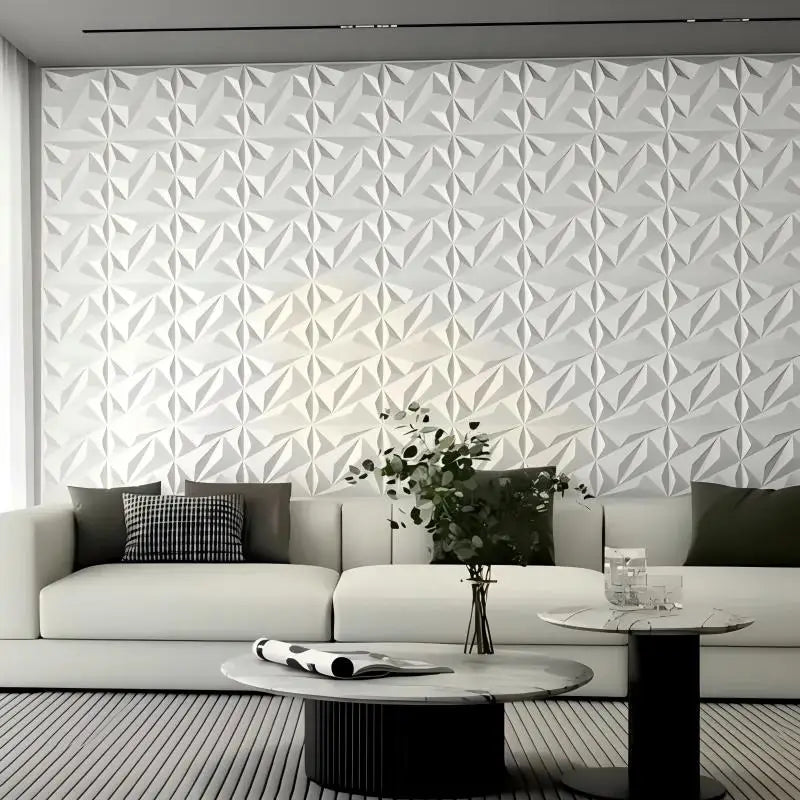 Modern living room with a geometric patterned wall and a sofa.