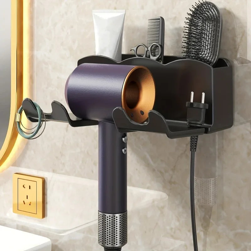 Hair dryer mounted on a wall with attachments and a tube of cream.