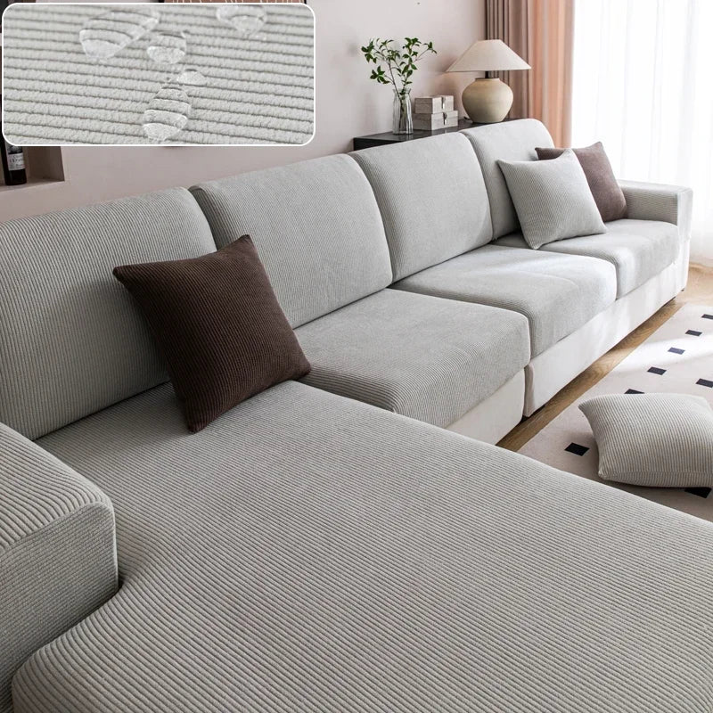 Gray sectional sofa with cushions in a living room setting