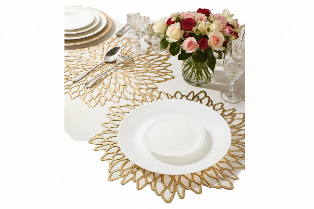 Decorative vinyl round placemat with gold lace design on a table setting.