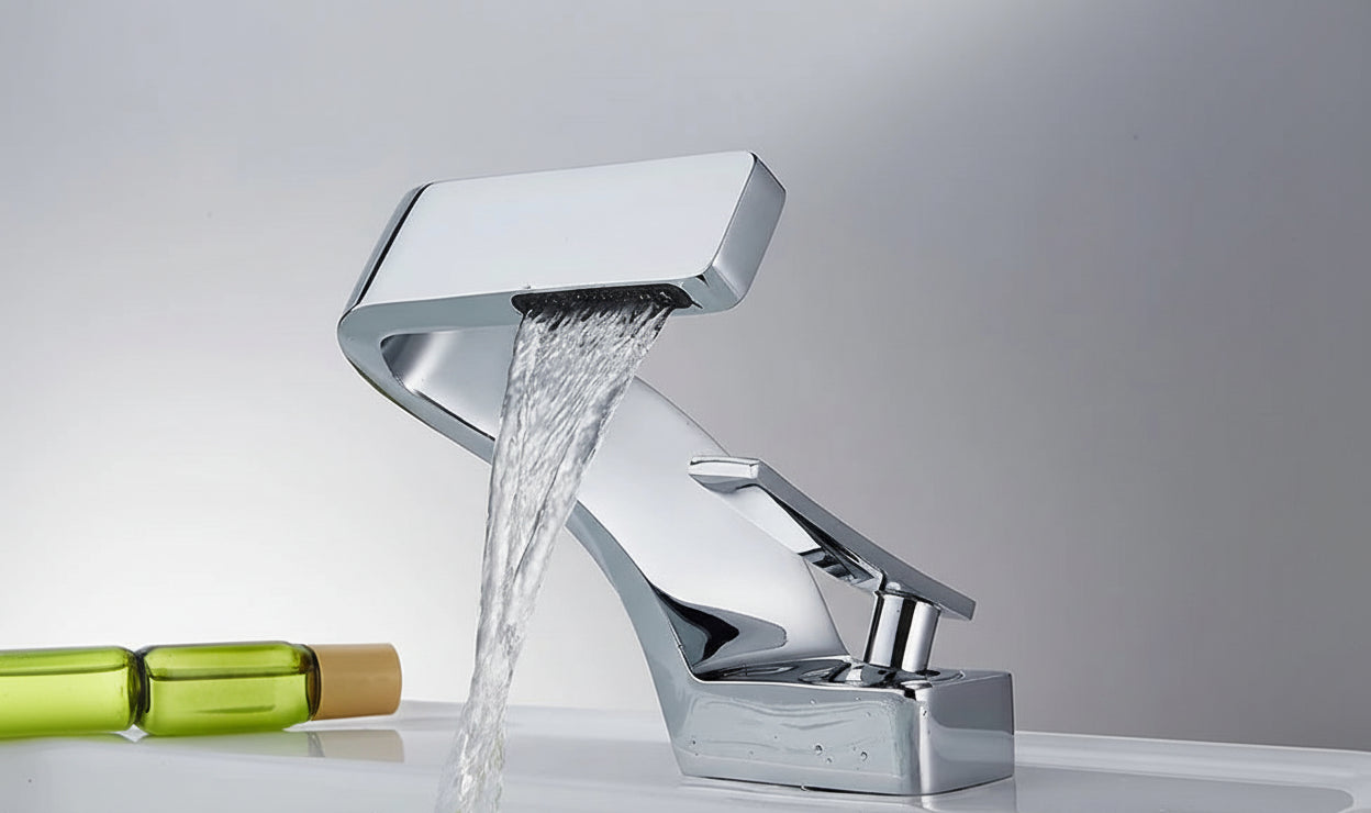 Chrome waterfall hot & cold water faucet with running water, TOLM brand visible.