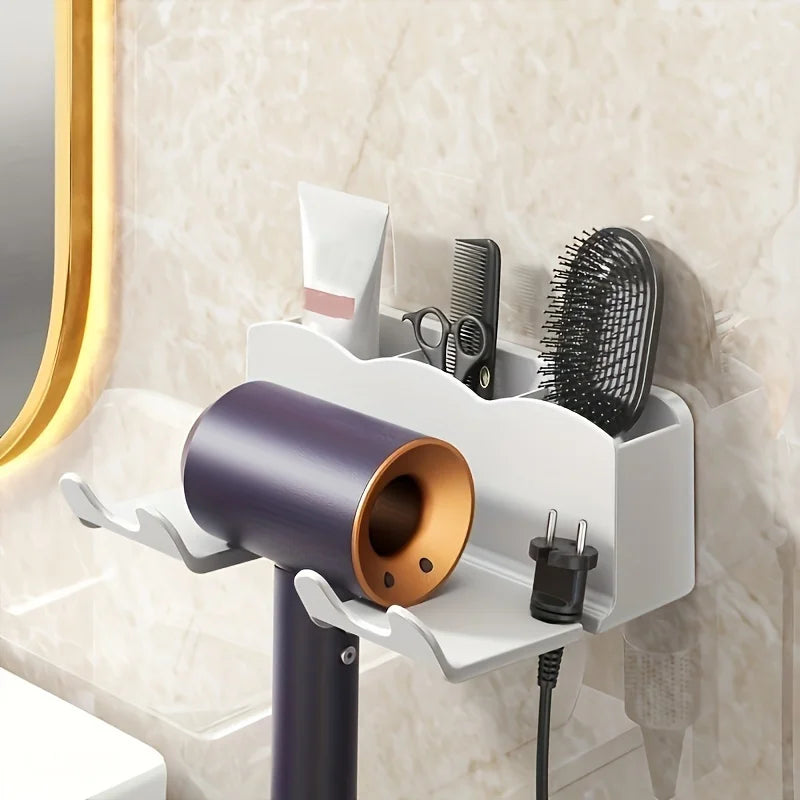 Wall-mounted hair dryer holder with a hair dryer, brush, and other items in a bathroom setting.
