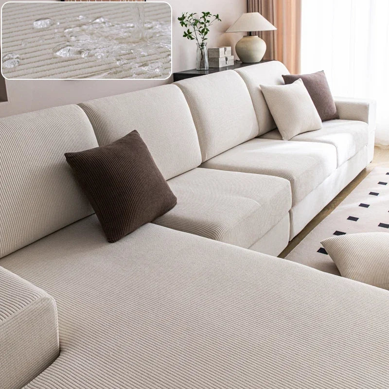 Beige sectional sofa with brown cushions in a living room setting.