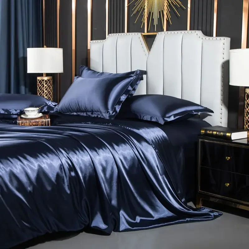 Navy satin bedding set on a bed in a stylish bedroom with decorative elements.