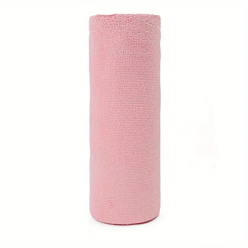 Pink cylindrical towel on a white background
