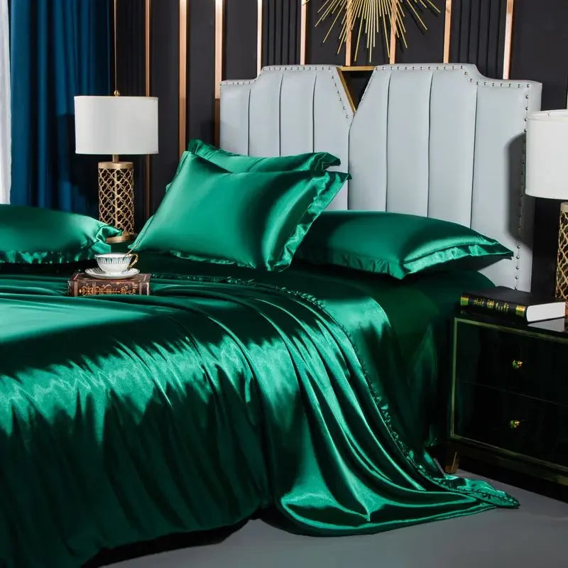Green satin bedding set on a bed in a stylish bedroom.