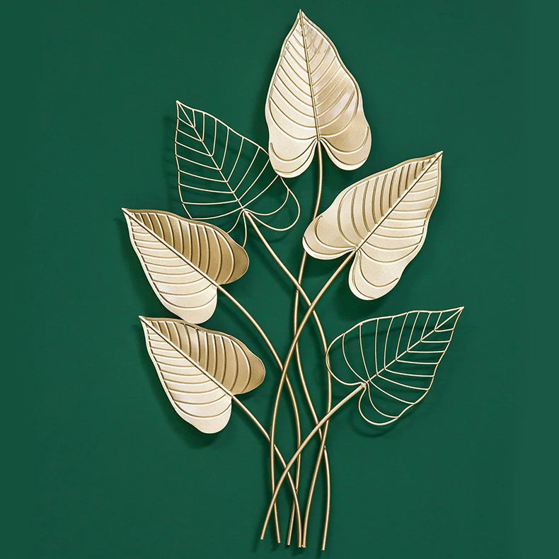 Decorative wall art with leaf designs on a green background