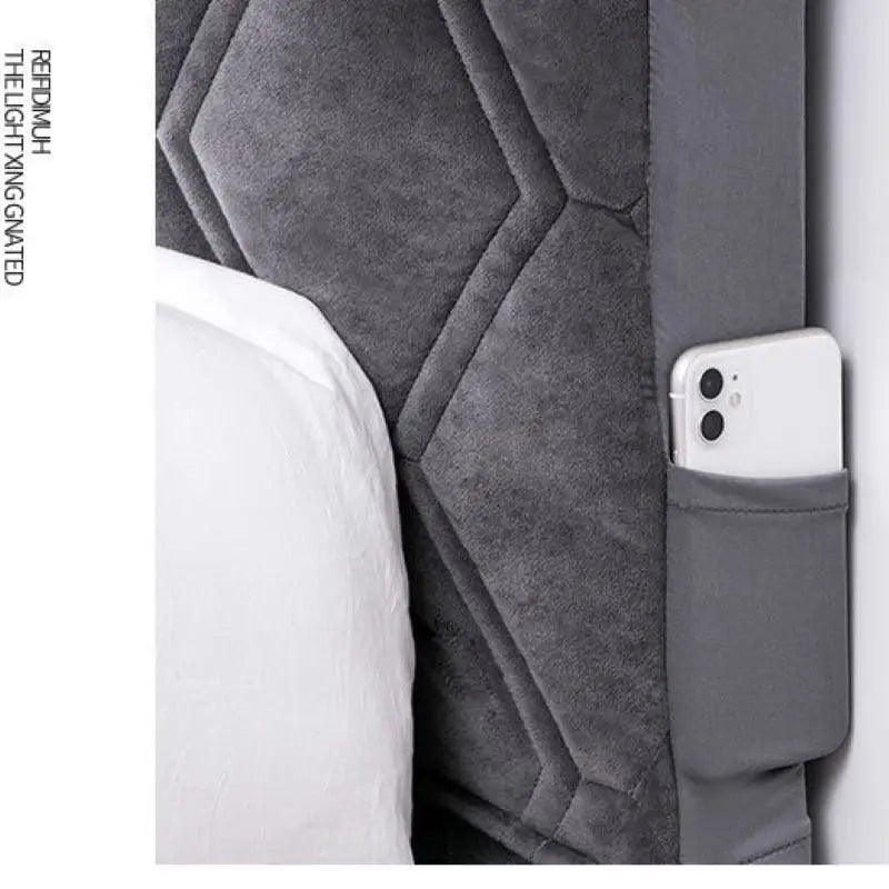 Gray textured product with a pocket holding a white phone on a white background