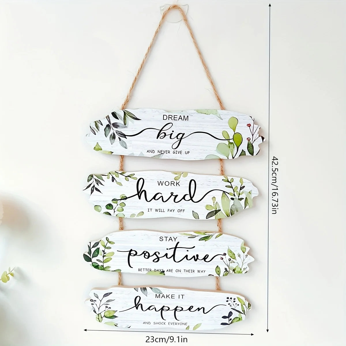 Decorative wall sign with motivational phrases and measurements on a white background