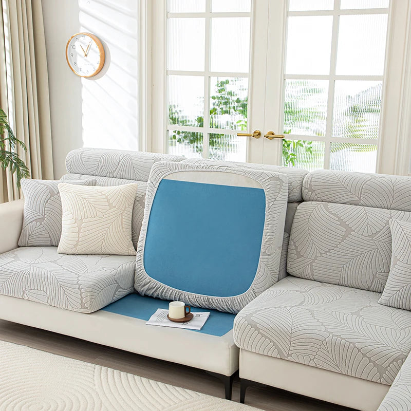 Gray sofa with a blue cushion in a bright living room