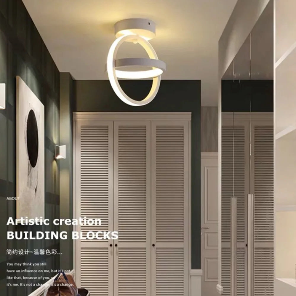 Modern ceiling light fixture in a room with wooden shutters and minimal decor.