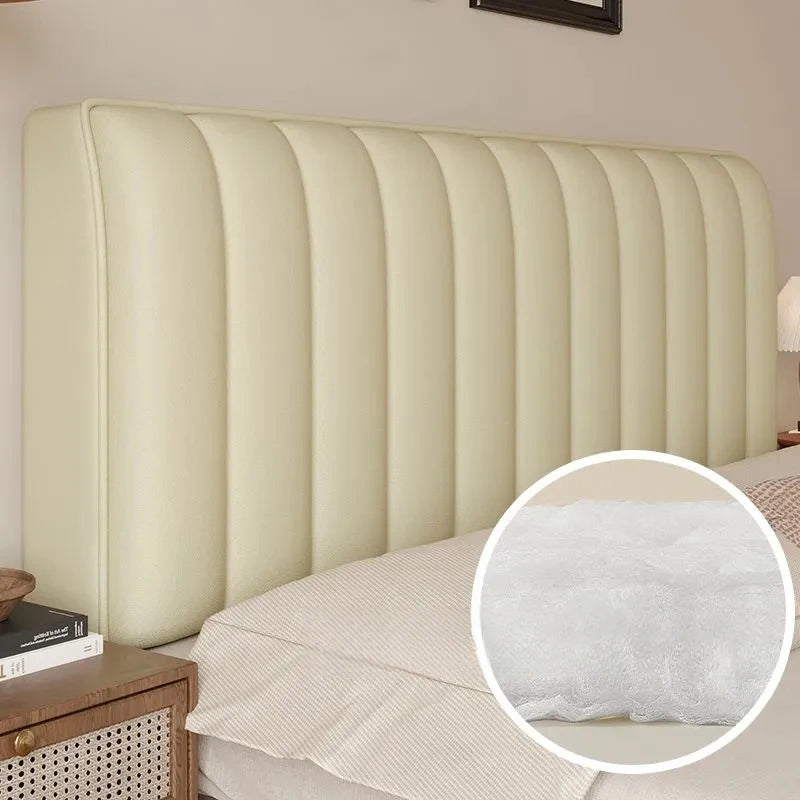 Beige upholstered headboard with close-up of padding detail