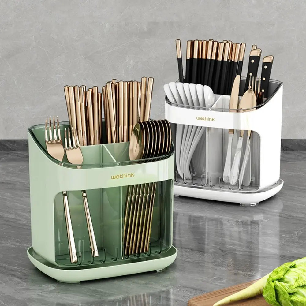 Two kitchen utensil organizers with cutlery on a gray countertop.