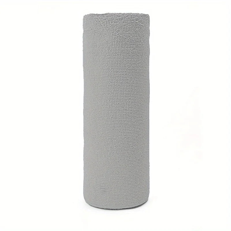 Rolled-up gray towel on a white background