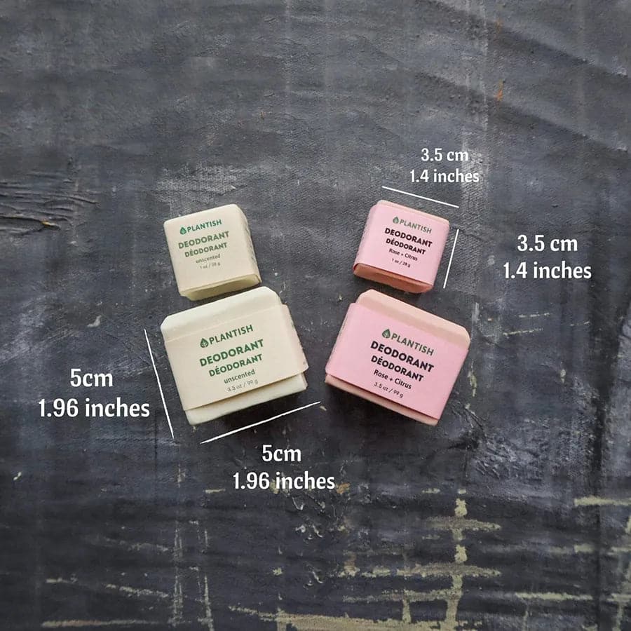 Four plant-based deodorant bars on a textured surface with measurements indicated.